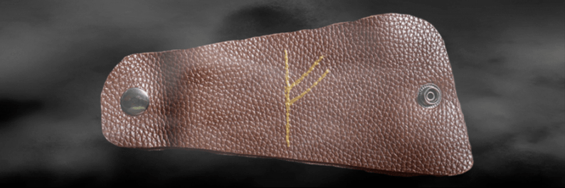 Fehu rune on the skin as an amulet of success