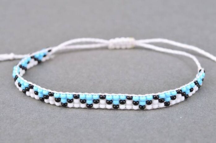 A bracelet made of threads and beads is a talisman that will bring good luck to the wearer